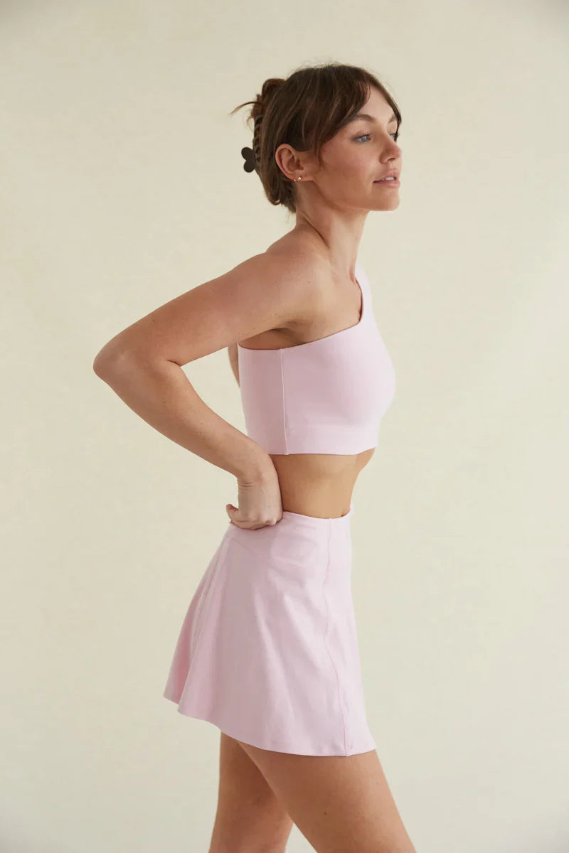 Avery Smoothing Flare Tennis Skort in Pink
